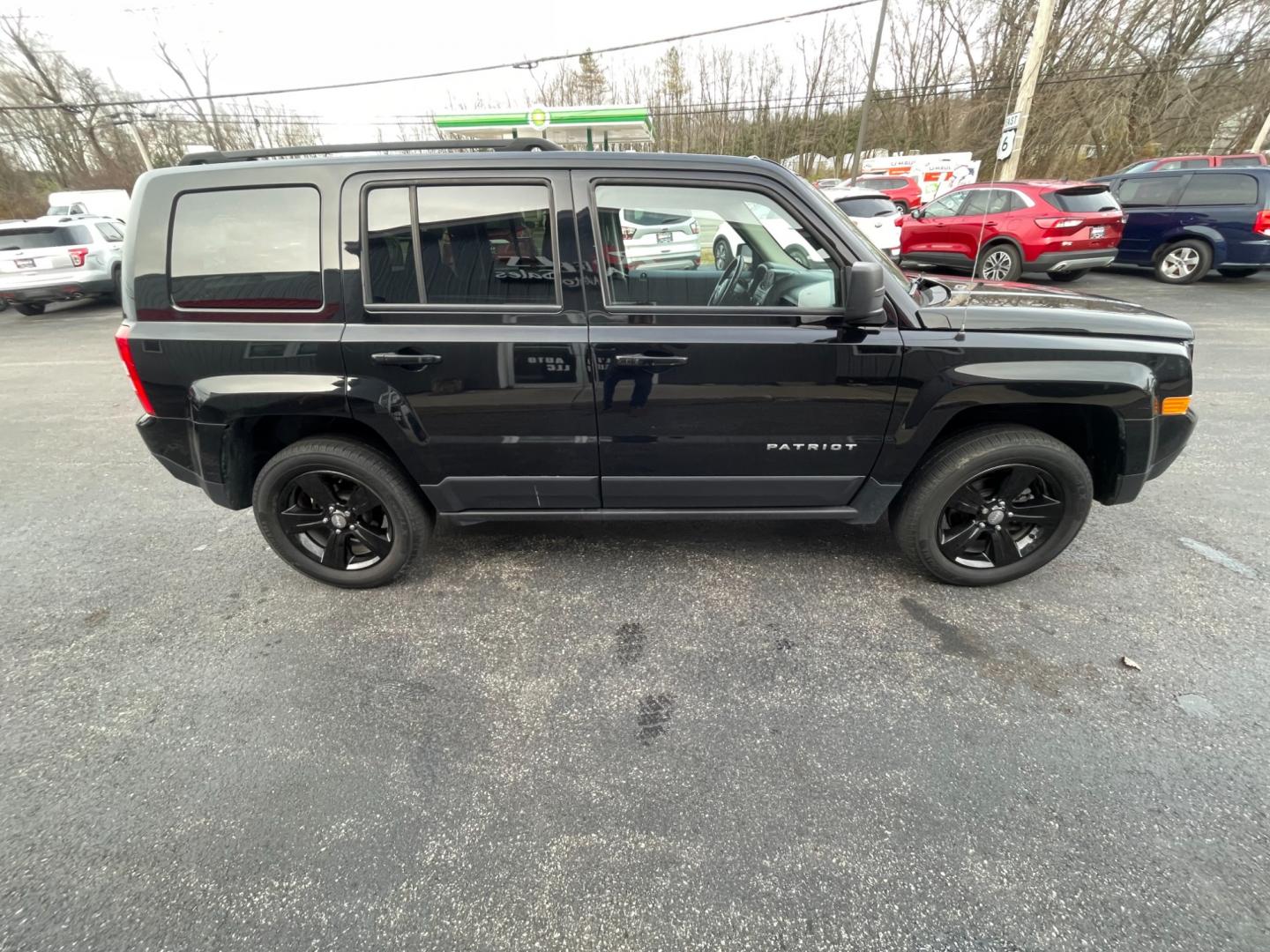 2017 Black /Black Jeep Patriot Latitude 4WD (1C4NJRFB5HD) with an 2.4L I4 DOHC 16V engine, 6-Speed Automatic transmission, located at 11115 Chardon Rd. , Chardon, OH, 44024, (440) 214-9705, 41.580246, -81.241943 - This 2017 Jeep Patriot Latitude with 4WD and only 55,000 miles on the odometer. This SUV comes equipped with a 2.4L engine for powerful performance. It features a comfortable and spacious interior with modern amenities. The 4WD capability ensures that you can handle any terrain or weather conditions - Photo#6